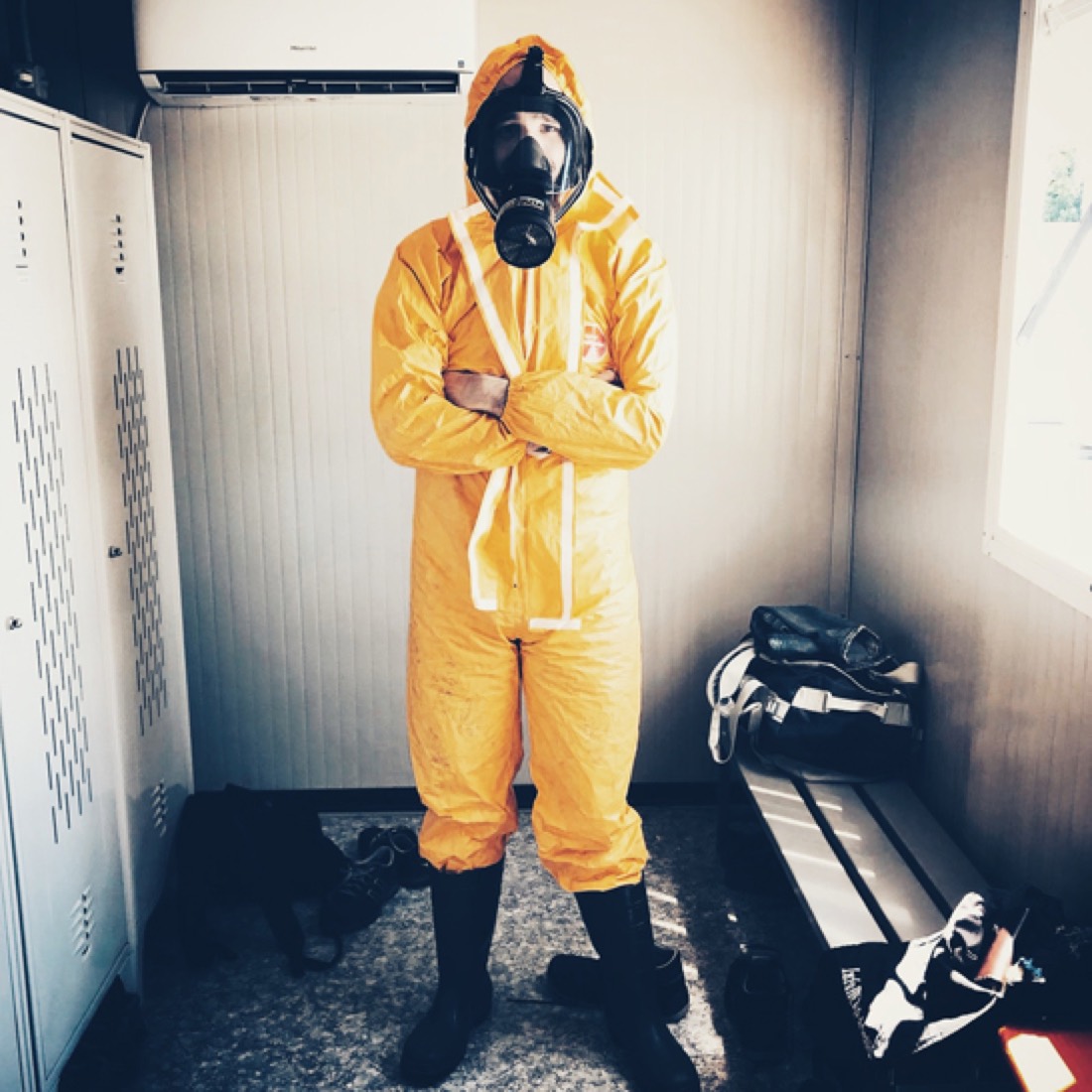 Firefighter in protective gear standing in a doorway