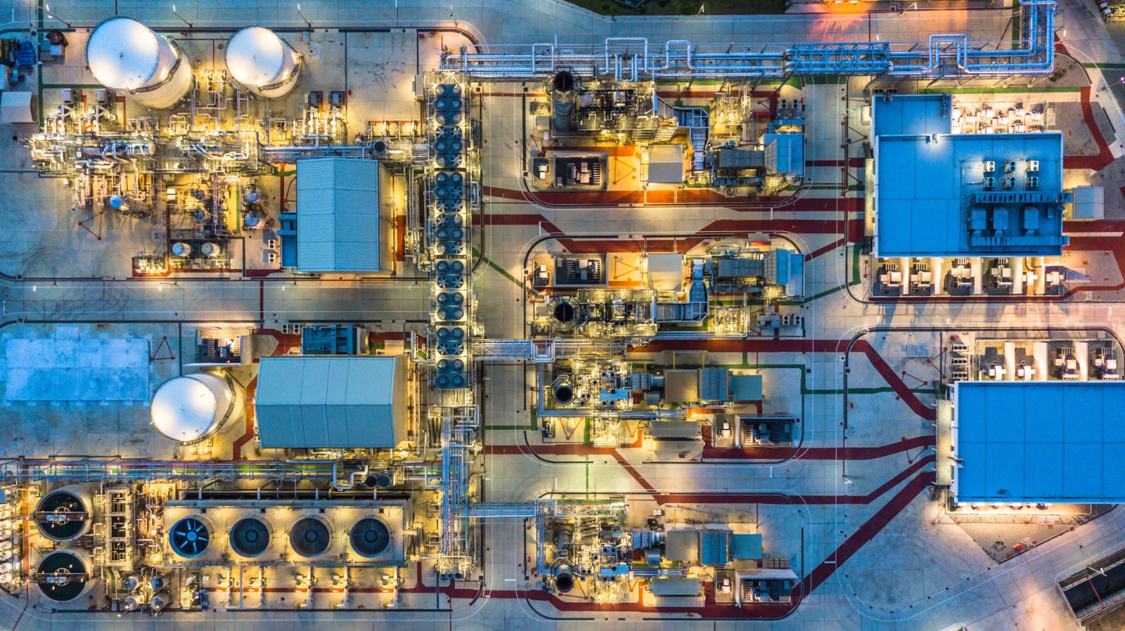 Refinery lit up at night, seen from above