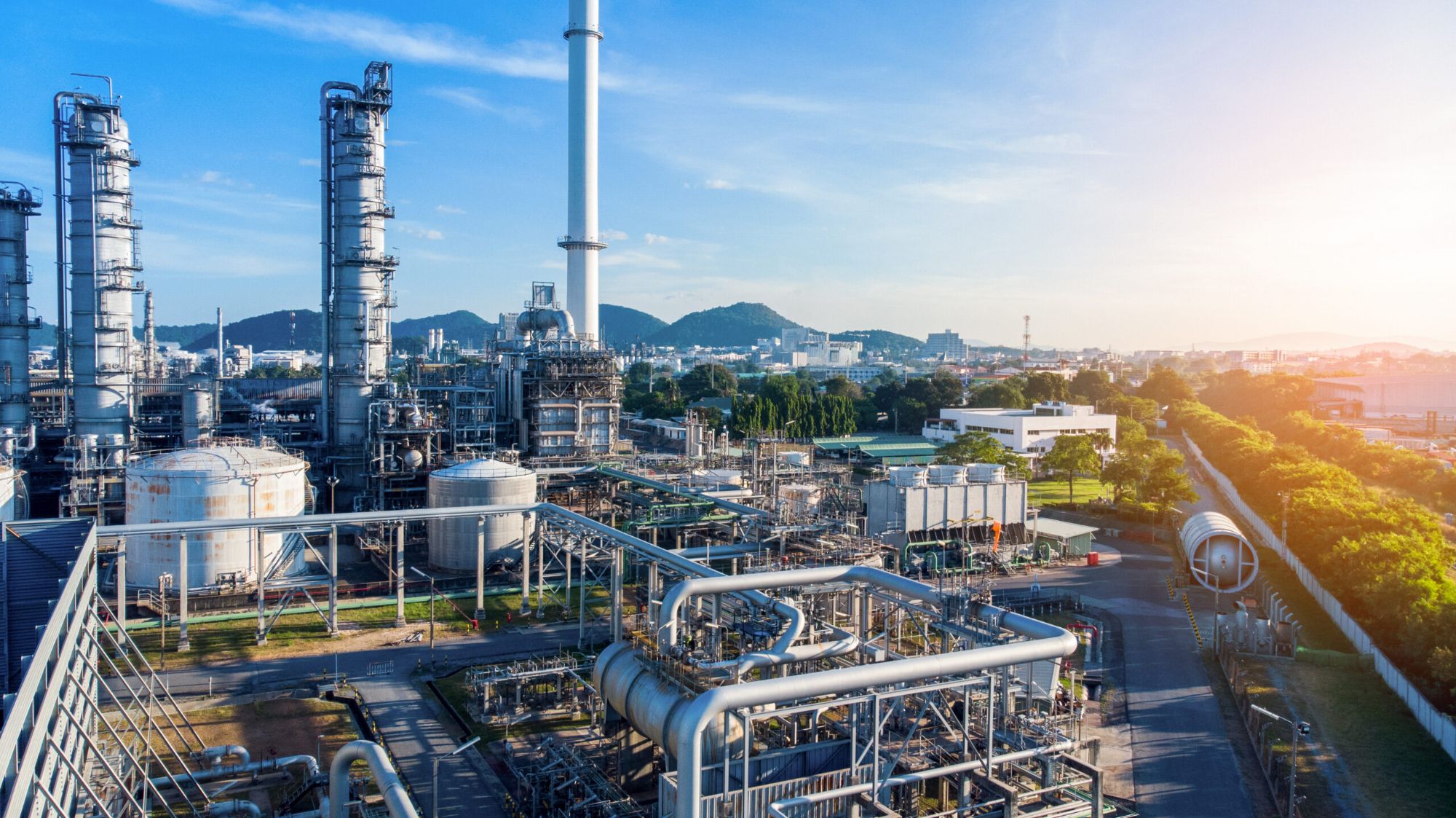 Refinery columns and stack at sunrise