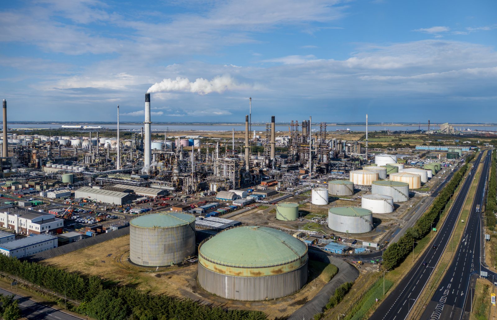 Aerial view of a large process plant with storage tanks